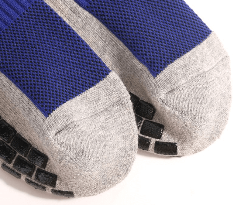 Blue and gray breathable non-slip sports socks with black silicone soles, designed for unisex football players, providing optimal grip.